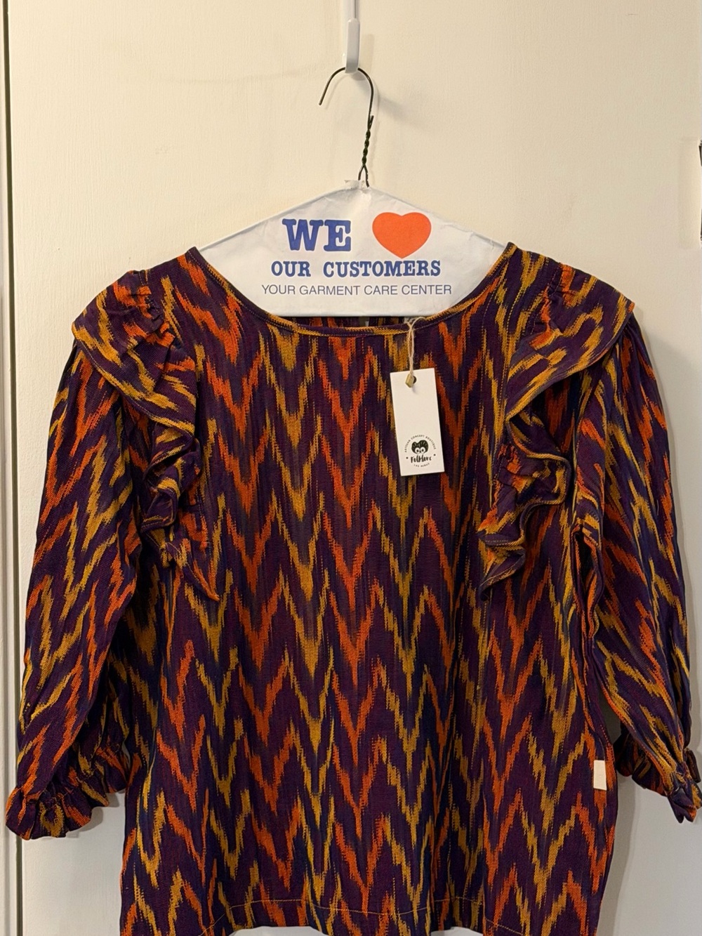 Folklore Las Niñas Girl’s Ruffled Chevron Print Blouse in Purple and Orange
